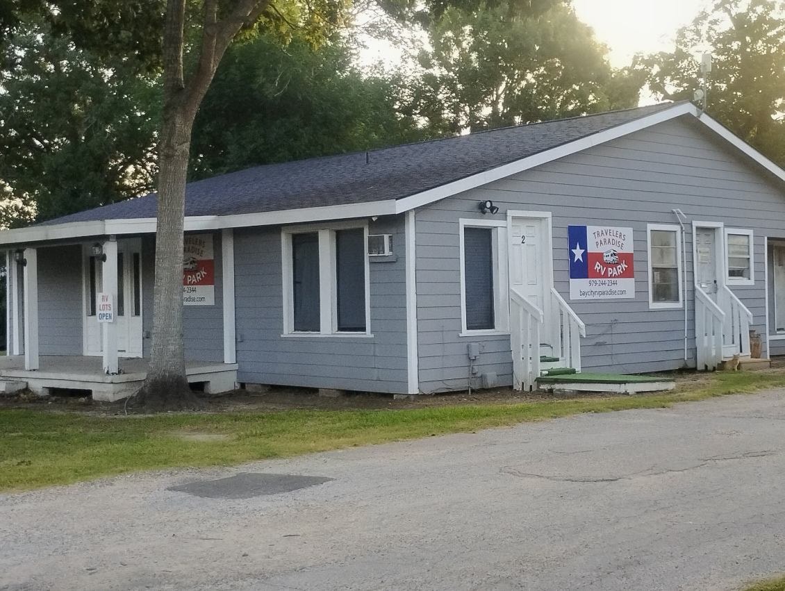 Main office and furnished studio building at Traveler's Paradise RV Park in Bay City, TX