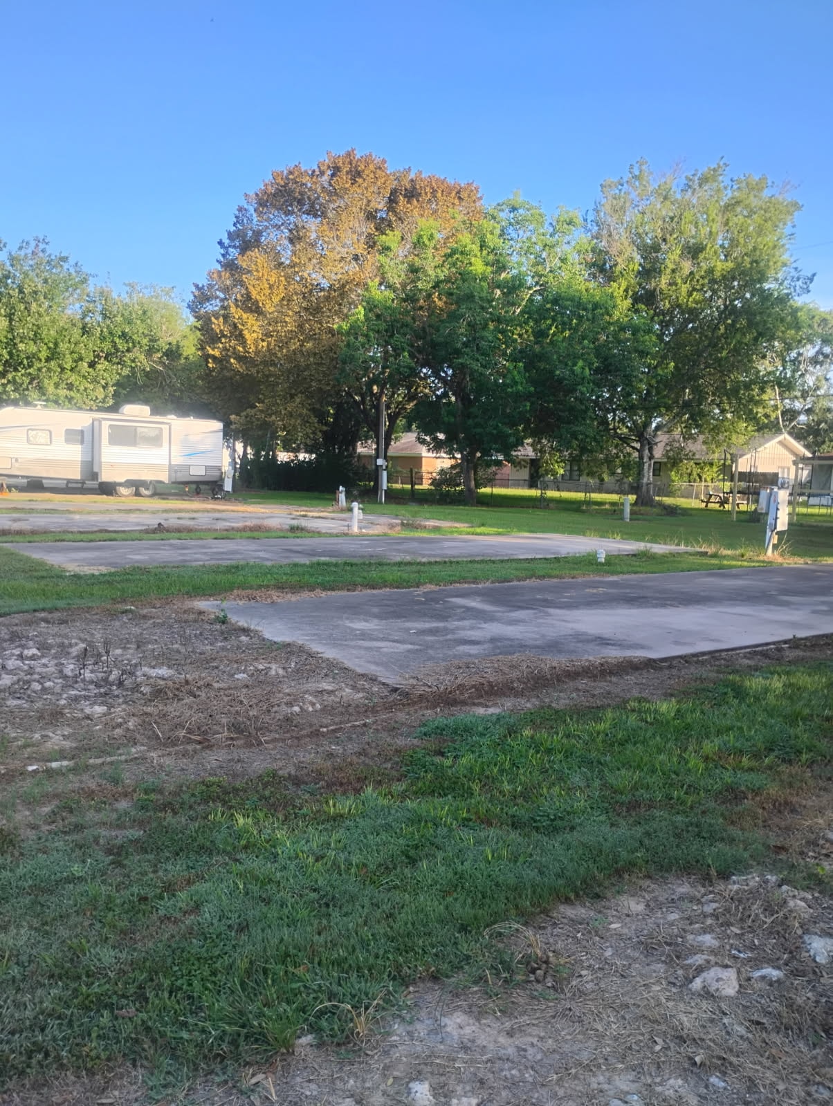 Concrete pad RV lot at Traveler's Paradise RV Park